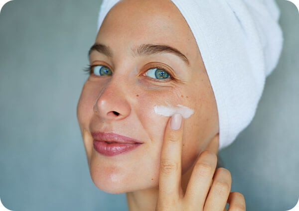 Woman applying cream